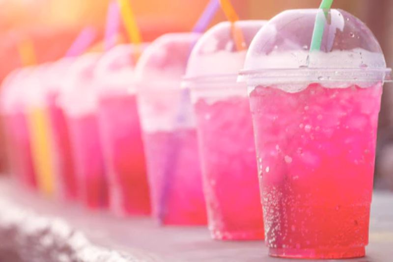 a line of cups full of pink colored loaded teas with ice. image credit: bistromd.com  